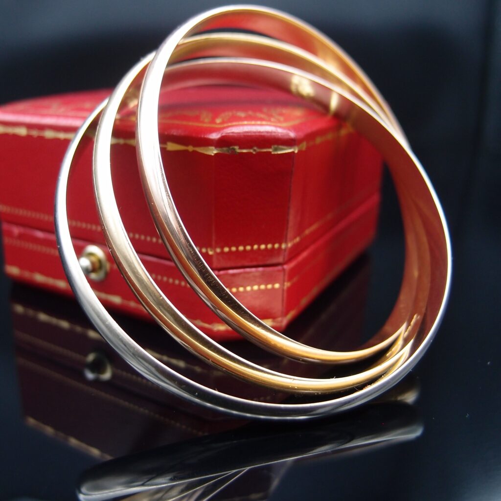 BRACELET CARTIER TRINITY, OR 18 CARATS , LARGEUR 6MM , POIDS 73.4 GRAMMES