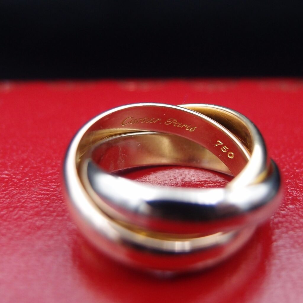 BAGUE CARTIER TRINITY, OR 18 CARATS , LARGEUR 4 MM , TAILLE 45 , POIDS 11.07 GRAMMES