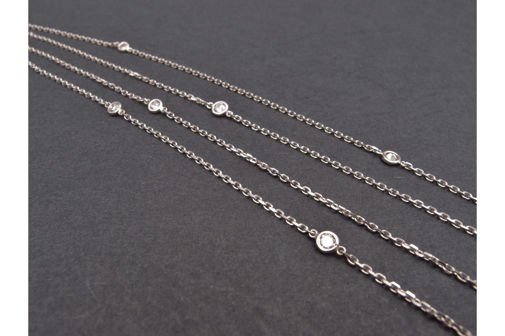 sautoir or gris et diamants